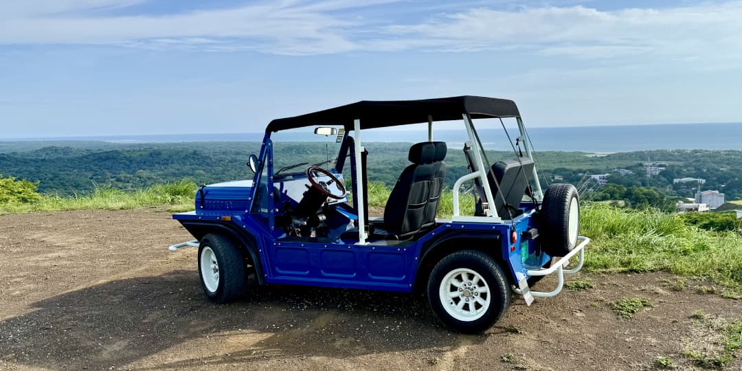 a blue vehicle with a black roof